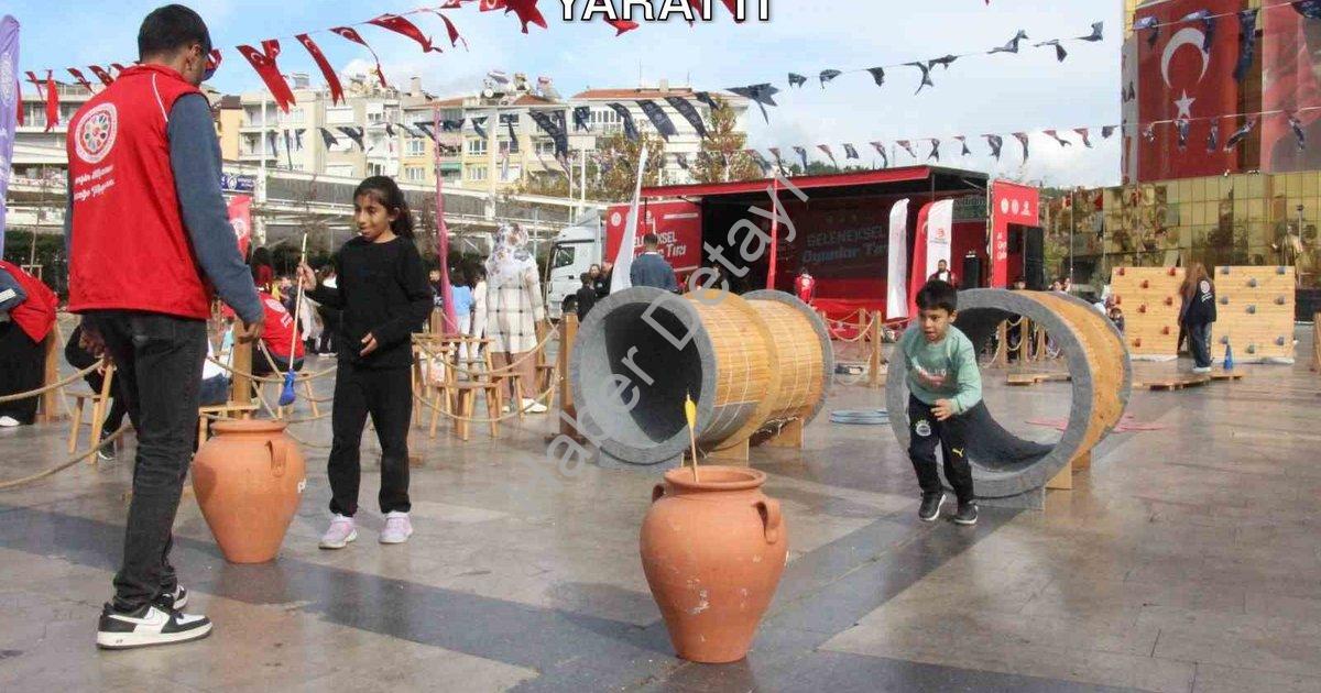 "Geleneksel Oyun Tırı Aydın'da Coşku Yarattı" başlıklı haber için fotorealistik, profesyonel bir hab